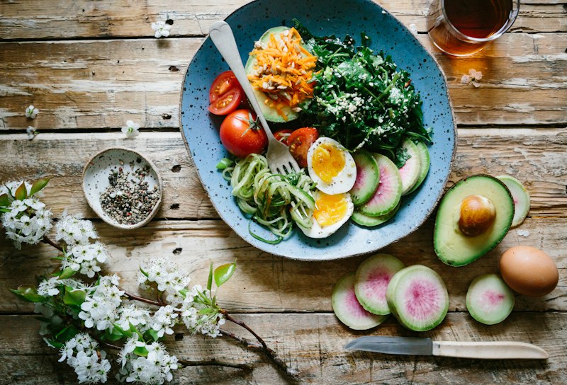 Fresh whole foods on a wooden surface, nutrition